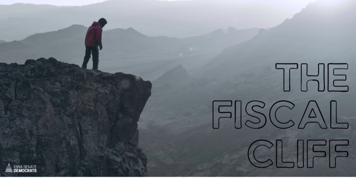 Person standing at the edge of a cliff representing the fiscal cliff concept in government spending and budget discussions